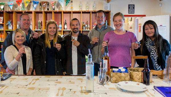 Our group sampling shots of liquor at one of the gourmet grocery stores we stopped at. 