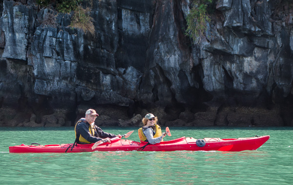 My parents paddling around Halong Bay. 