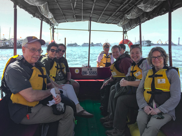 The crew on the small boat heading to the Red Dragon. 