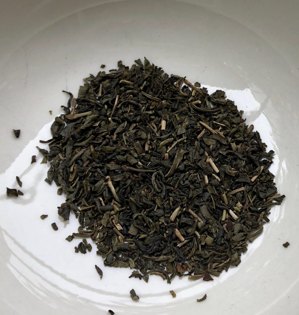 This is green jasmine tea, the white pieces are the jasmine.